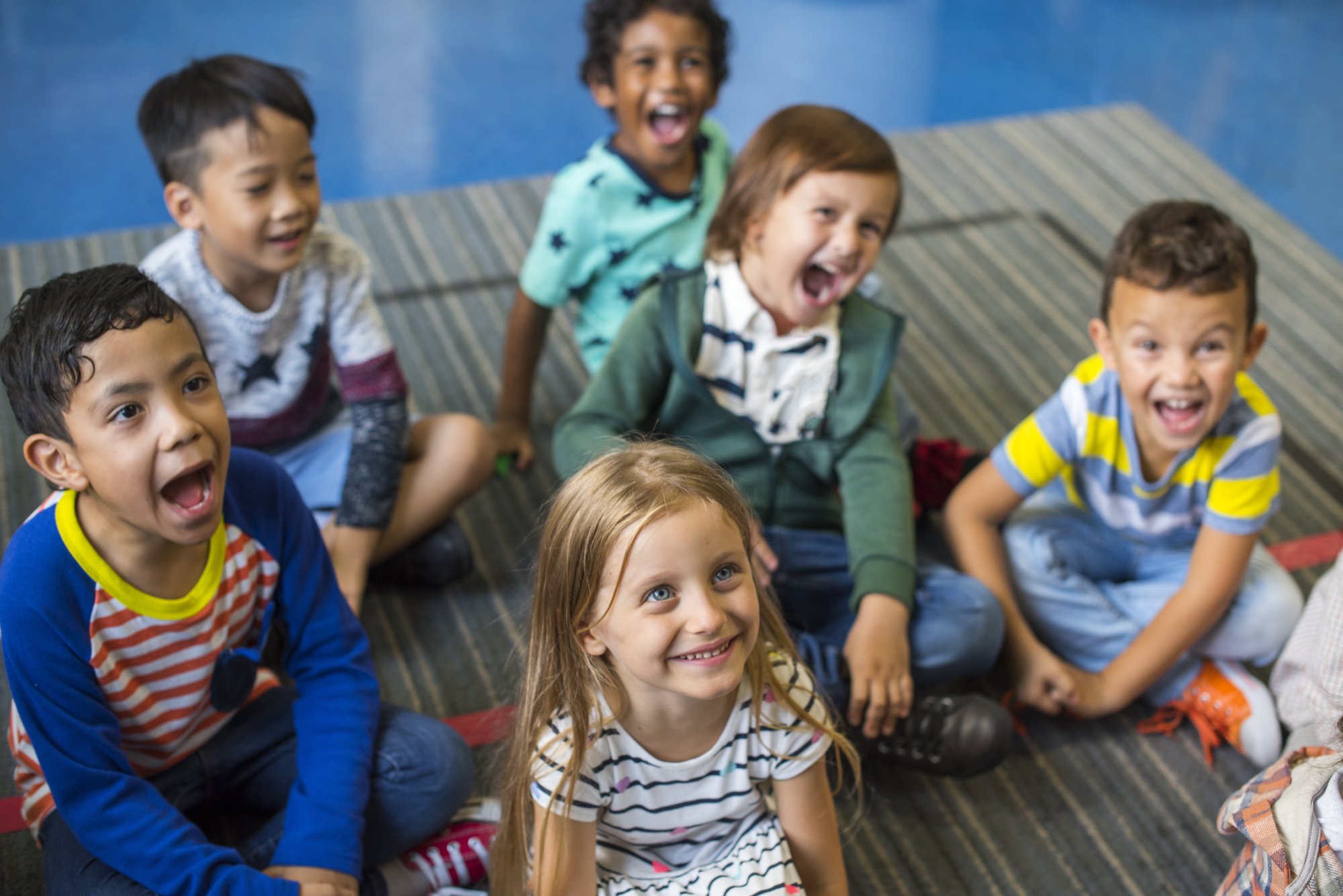 Kids sitting on carpet